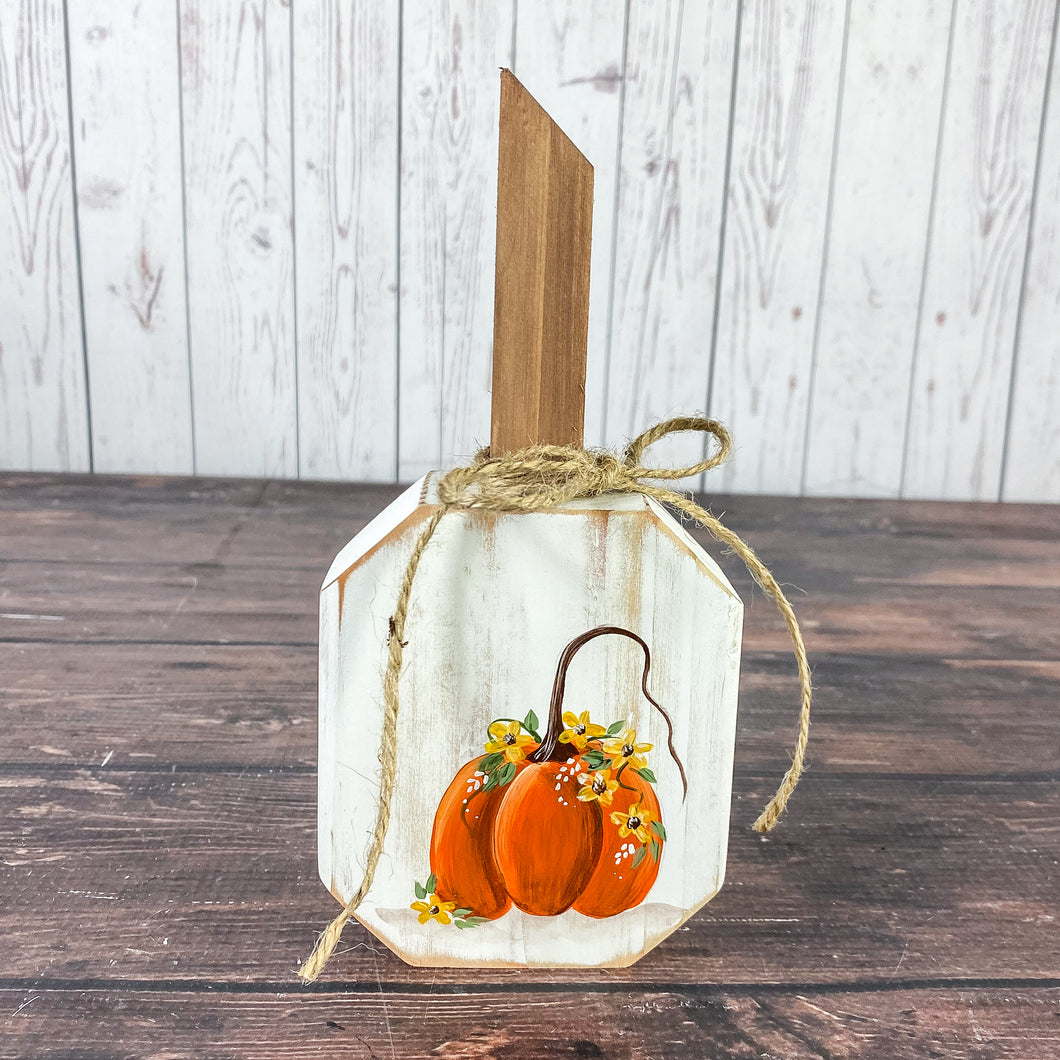 Small white pumpkin with orange pumpkin